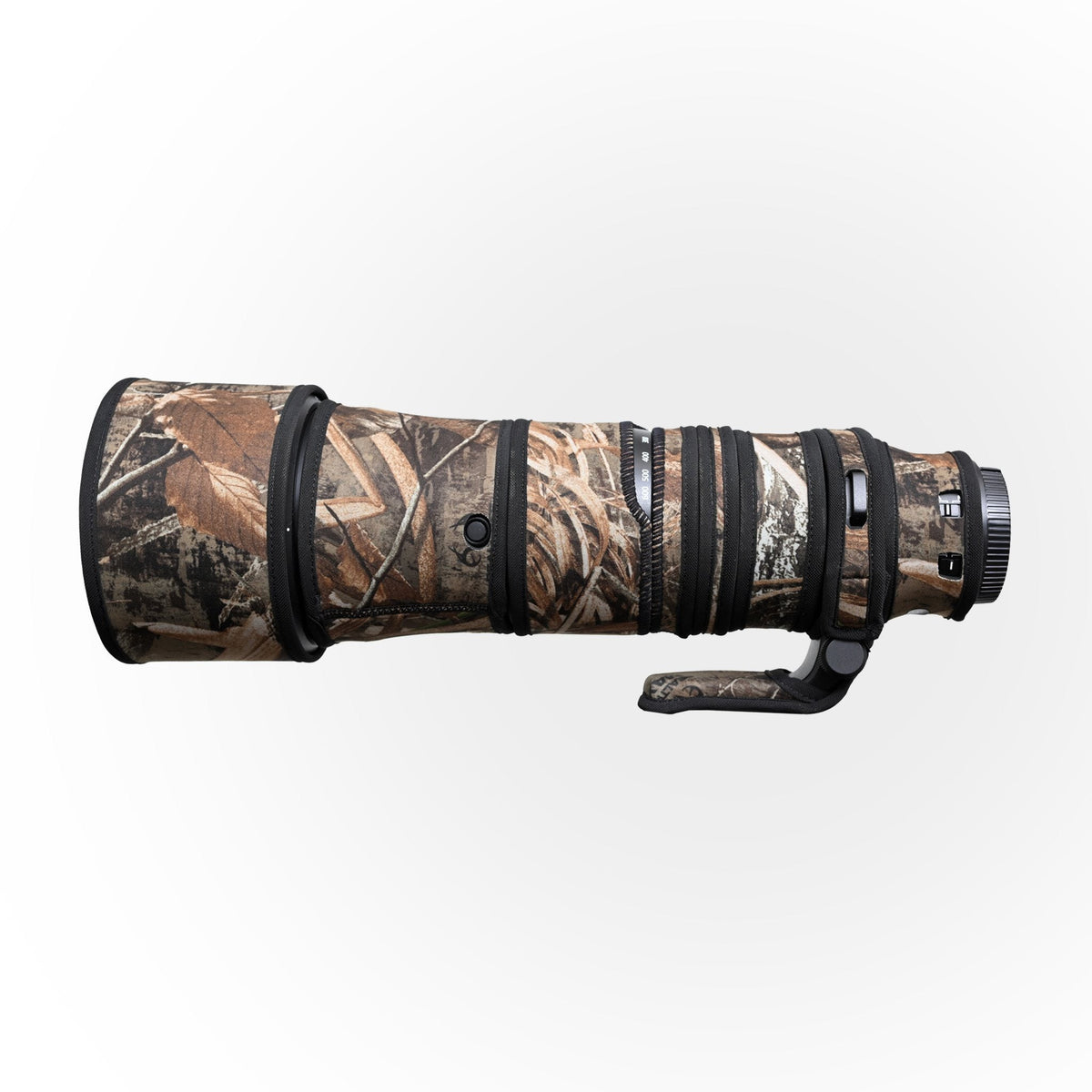 Max Camo lens cover on Nikon Z 180-600mm showing cut-outs for the function buttons and switches